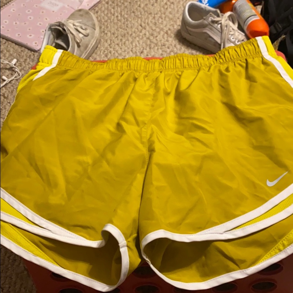 Yellow Nike running shorts